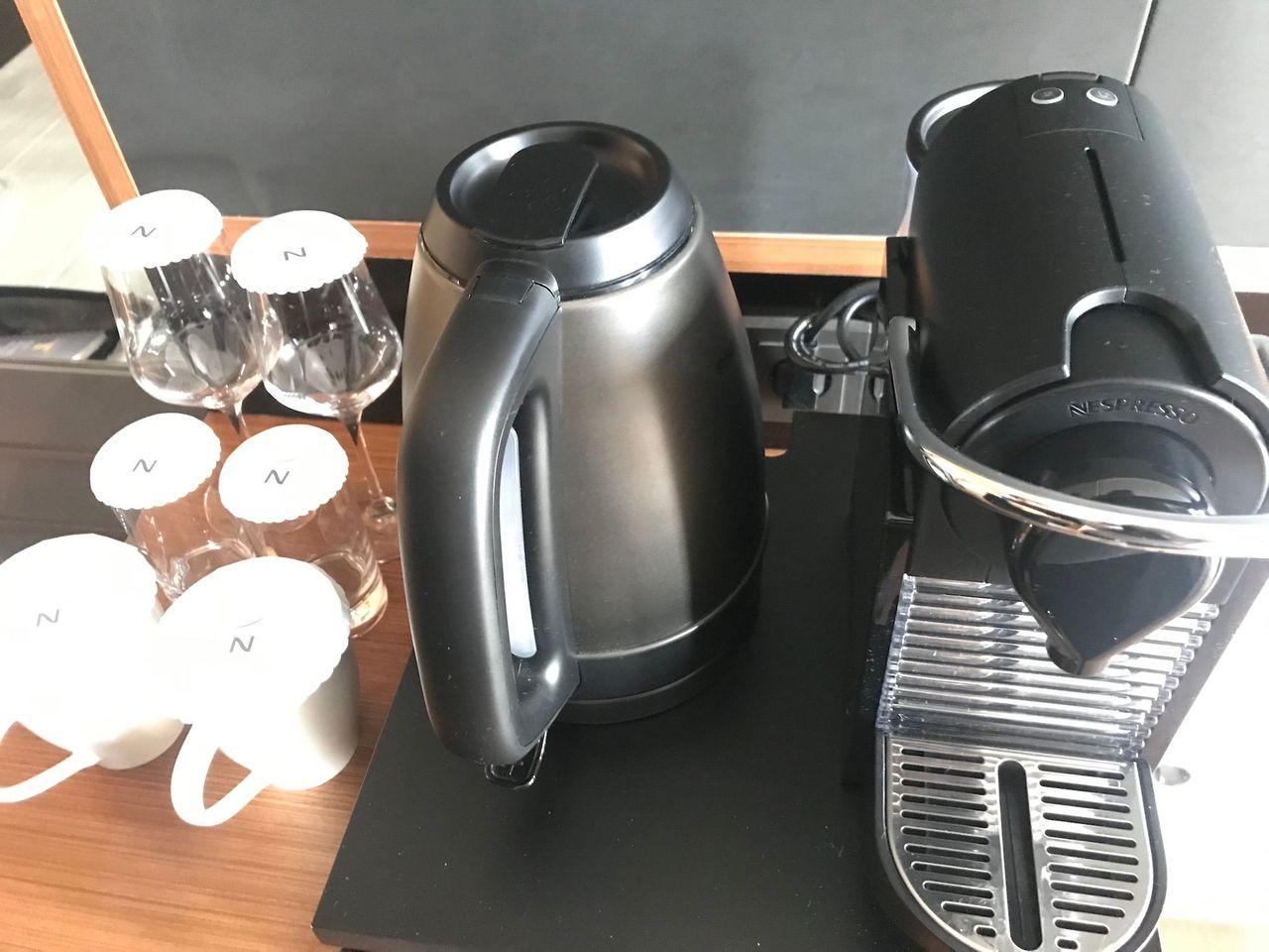 Nespresso coffee machine and kettle setup in the kitchen area of Dongdaemun Novotel Ambassador Hotel.